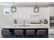 Kitchen with a large island, stainless steel appliances and bar stool seating at 169 Hidden Bluff Dr, Chapel Hill, NC 27517