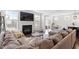 Spacious living room with fireplace, large sectional sofa, and view into the kitchen at 169 Hidden Bluff Dr, Chapel Hill, NC 27517