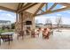 Outdoor lounge with stone fireplace, comfortable seating, and stylish decor at 169 Hidden Bluff Dr, Chapel Hill, NC 27517
