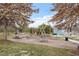 Community playground with swings and picnic area set amidst mature trees in a serene park-like setting at 169 Hidden Bluff Dr, Chapel Hill, NC 27517
