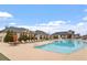 Beautiful community pool area with lounge seating and umbrellas at 169 Hidden Bluff Dr, Chapel Hill, NC 27517