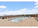 Inviting community pool with ample lounge chairs and umbrellas at 169 Hidden Bluff Dr, Chapel Hill, NC 27517