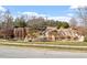Scenic waterfall feature with lush landscaping and rock formations at 169 Hidden Bluff Dr, Chapel Hill, NC 27517