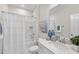 Bright bathroom featuring a shower-tub combination and a neutral color palette with modern decor accents at 1800 Bright Lantern Way, Wendell, NC 27591