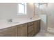Bathroom features double sink vanity with solid surface counter and glass enclosed shower at 1800 Bright Lantern Way, Wendell, NC 27591