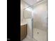 Bathroom with glass enclosed shower with marble-look surround and white marble-look floors at 1800 Bright Lantern Way, Wendell, NC 27591