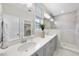 This bathroom features a double vanity, large mirrors, and a tiled shower at 1800 Bright Lantern Way, Wendell, NC 27591