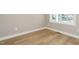 Neutral bedroom with light wood floors, base trim, and natural light at 1800 Bright Lantern Way, Wendell, NC 27591
