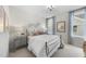 Serene bedroom featuring a comfortable bed, stylish decor, and plenty of natural light at 1800 Bright Lantern Way, Wendell, NC 27591