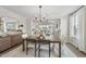 An open-concept dining room leads to the living room with vaulted ceilings at 1800 Bright Lantern Way, Wendell, NC 27591