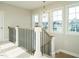 This is a hallway with a chandelier and natural light at 1800 Bright Lantern Way, Wendell, NC 27591