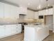 Gorgeous kitchen with stainless appliances, granite countertops, and white cabinetry at 1800 Bright Lantern Way, Wendell, NC 27591