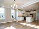 Modern kitchen features white cabinets, stainless steel appliances, and a large island at 1800 Bright Lantern Way, Wendell, NC 27591