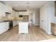 Bright kitchen showcasing stainless steel appliances, granite counters, and a functional center island at 1800 Bright Lantern Way, Wendell, NC 27591