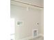 This is a laundry room with utility connections and shelving at 1800 Bright Lantern Way, Wendell, NC 27591