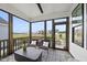 Inviting screened porch featuring stylish furniture, an outdoor ceiling fan, and a peaceful ambiance at 1800 Bright Lantern Way, Wendell, NC 27591