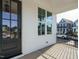View of the front porch area with a black framed window and door at 1800 Bright Lantern Way, Wendell, NC 27591
