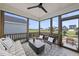 Relaxing screened porch with comfortable seating and scenic views of the surrounding neighborhood at 1800 Bright Lantern Way, Wendell, NC 27591