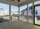 Inviting screened porch boasts wood flooring and views of the backyard and surrounding neighborhood at 1800 Bright Lantern Way, Wendell, NC 27591