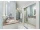 Bathroom features a granite countertop, white cabinets, modern fixtures, large mirrors, and a glass enclosed shower at 1801 Oatlands Ct, Wake Forest, NC 27587