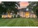 Expansive lawn leads up to this attractive stone home with meticulously maintained landscaping at 1801 Oatlands Ct, Wake Forest, NC 27587