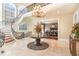 Grand foyer with a curved staircase, elegant chandelier, and marble flooring at 1801 Oatlands Ct, Wake Forest, NC 27587