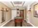 Inviting game room with foosball table, dark wood floors, and unique lighting features at 1801 Oatlands Ct, Wake Forest, NC 27587
