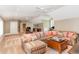 Spacious living room with carpet flooring, a sectional sofa, and a coffee table with a game at 1801 Oatlands Ct, Wake Forest, NC 27587