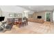 Spacious living room with vaulted ceilings, carpet flooring, a TV, and a gaming setup at 1801 Oatlands Ct, Wake Forest, NC 27587