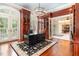 Executive office with hardwood floors, custom cabinetry, and ample natural light at 1801 Oatlands Ct, Wake Forest, NC 27587