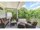 Covered patio with comfortable seating, offering a relaxing outdoor space at 1801 Oatlands Ct, Wake Forest, NC 27587