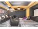Home theater room with plush seating, projector, and screen for entertainment at 1801 Oatlands Ct, Wake Forest, NC 27587