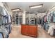 Enormous walk-in closet with custom shelving, multiple clothing racks, a center island, and carpet at 1801 Oatlands Ct, Wake Forest, NC 27587