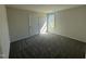 Bright bedroom with a neutral color palette, plush carpet and a window providing natural light at 181 Tulipfield Way, Benson, NC 27504