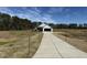 Wide view of a home with attached garage and concrete driveway on a large lot at 181 Tulipfield Way, Benson, NC 27504