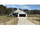 Charming home featuring an attached two-car garage and a well-maintained front yard at 181 Tulipfield Way, Benson, NC 27504