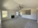 A large, open living room adjacent to the kitchen and featuring a fireplace at 181 Tulipfield Way, Benson, NC 27504