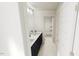 Bright bathroom with double vanity, dark cabinets, and a view into the shower area at 1903 Plott Balsam Dr, Wendell, NC 27591