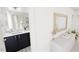 Modern bathroom with dual vanity sinks, decorative tiled floor, and stylish mirror at 1903 Plott Balsam Dr, Wendell, NC 27591