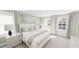 Serene bedroom with plush bedding, white furniture and large windows with lots of natural light at 1903 Plott Balsam Dr, Wendell, NC 27591