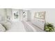 Calm and bright bedroom with white linens, large windows, and modern decor accents at 1903 Plott Balsam Dr, Wendell, NC 27591