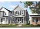 Charming two-story home with covered front porch and professionally landscaped front yard at 1903 Plott Balsam Dr, Wendell, NC 27591