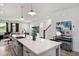 Open kitchen with a large island, bar seating, and an adjacent living area at 1903 Plott Balsam Dr, Wendell, NC 27591