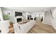 Bright and airy living room featuring hardwood floors, fireplace, and open concept design at 1903 Plott Balsam Dr, Wendell, NC 27591
