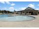 Community swimming pool with lounge chairs and splash features on a sunny day at 1903 Plott Balsam Dr, Wendell, NC 27591