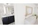 Stylish bathroom featuring navy vanity, patterned tile flooring, and ample storage space at 1903 Plott Balsam Dr, Wendell, NC 27591