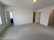 Bright bedroom showcasing neutral carpet, recessed lighting and ensuite bathroom entry at 1903 Plott Balsam Dr, Wendell, NC 27591