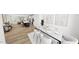 Bright dining room features sleek white table, stylish seating, and modern decor and flooring at 1903 Plott Balsam Dr, Wendell, NC 27591