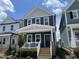 Charming two-story home features a welcoming front porch and a modern blue door at 1903 Plott Balsam Dr, Wendell, NC 27591