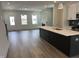 A spacious kitchen with modern appliances, a large island, and an open floor plan at 1903 Plott Balsam Dr, Wendell, NC 27591